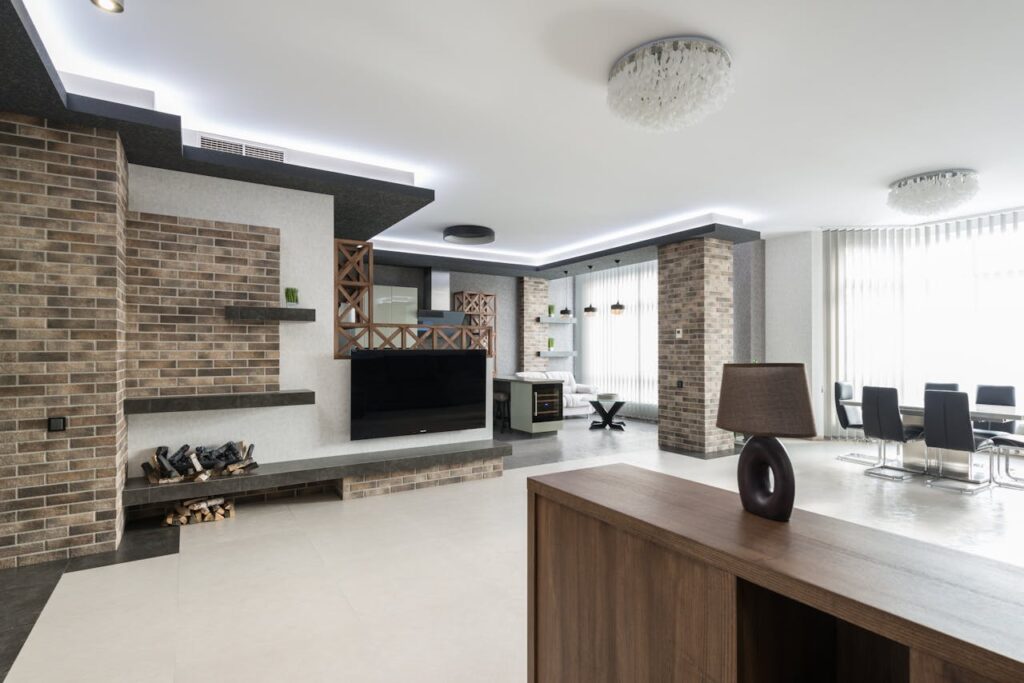 pexels photo 7227630 Modern TV at decorated wall in spacious living room with wooden cupboard in light apartment with table near big window